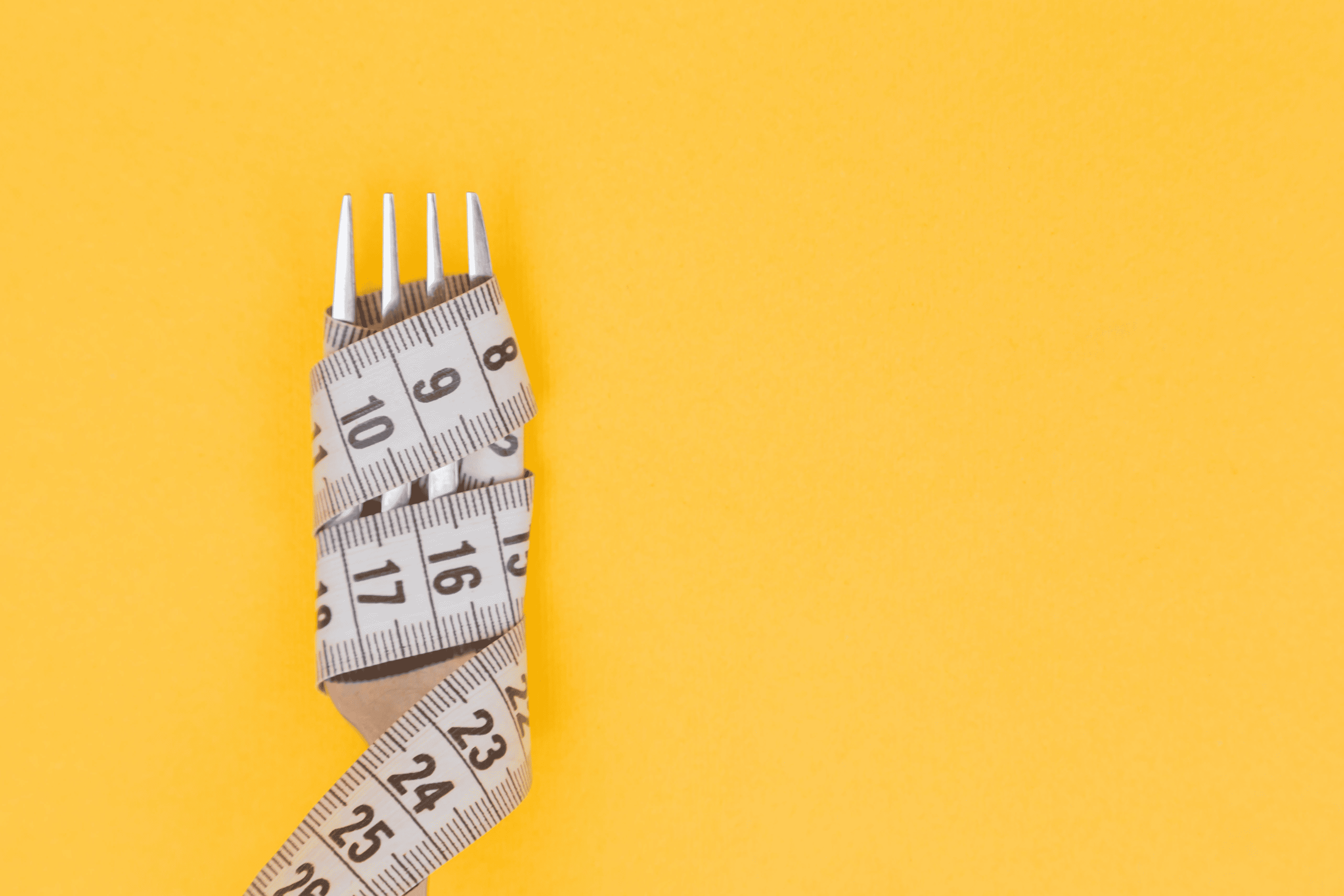 Measuring tape wrapped on a fork